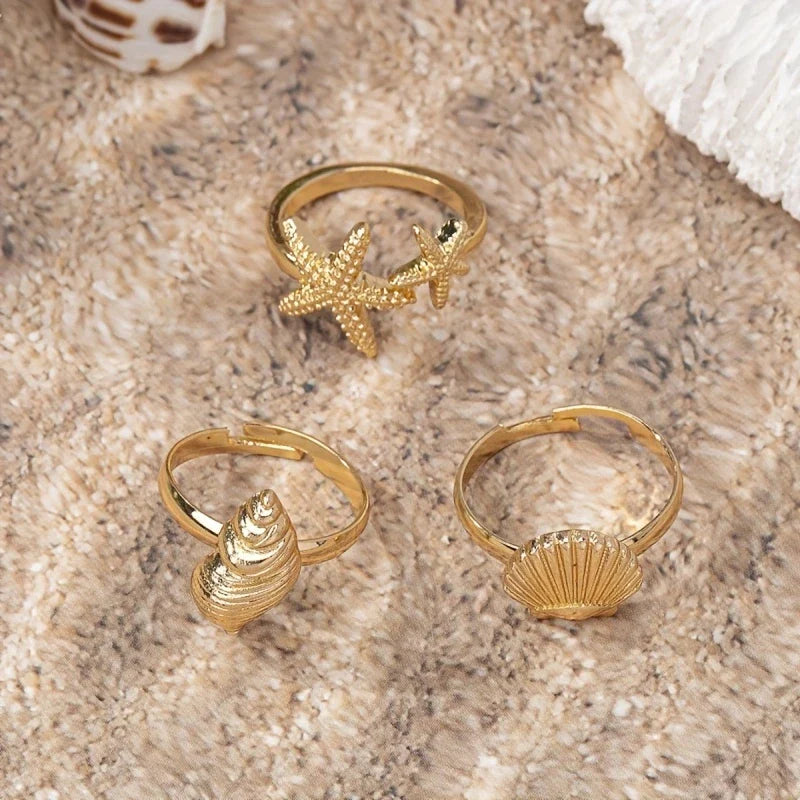 Set of 3 Gold-tone Shell, Star and Conch Rings