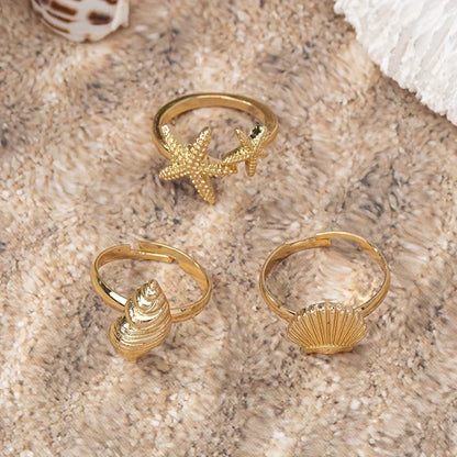 Set of 3 Gold-tone Shell, Star and Conch Rings