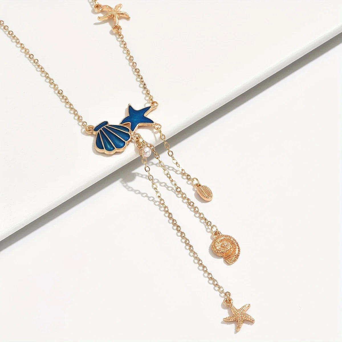 Elegant Gold-tone Necklace with Star and Blue Shell