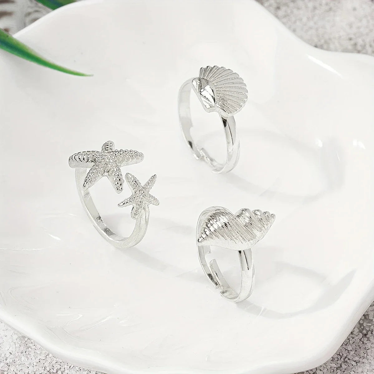 Set of 3 Gold-tone Shell, Star and Conch Rings