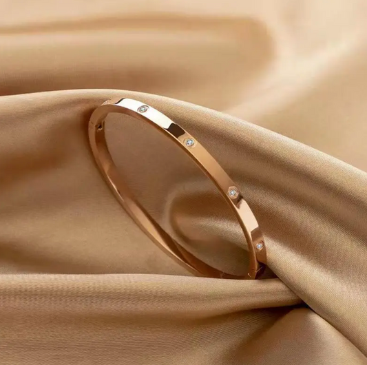 Golden Solid Bracelet with Double-Set Cubic Zirconias