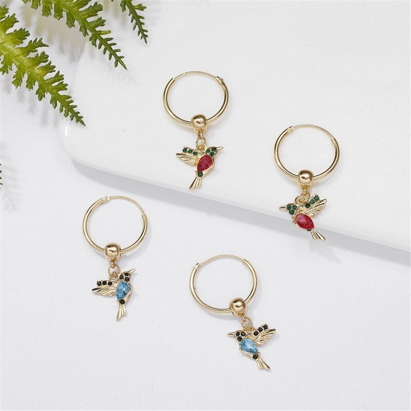 Limited edition flying hummingbird earrings with double-set cubic zirconia